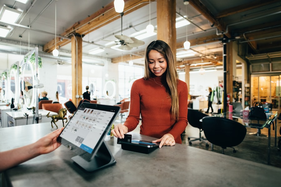 A shop owner taking a card payment at the counter